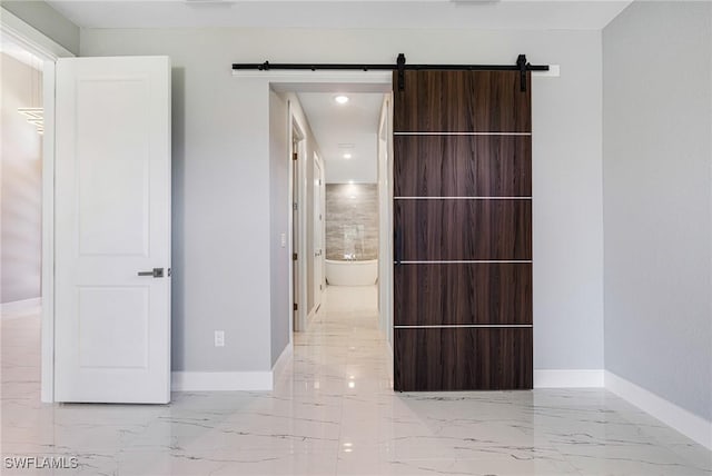 1316 SW 23rd St, Cape Coral, FL 33991 - corridor with marble tiled flooring, baseboards, recessed lighting, and a barn door