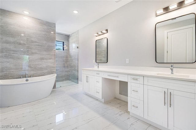 1316 SW 23rd St, Cape Coral, FL 33991 - full bathroom featuring marble finish floors, double vanity, a freestanding tub, a shower stall, and recessed lighting