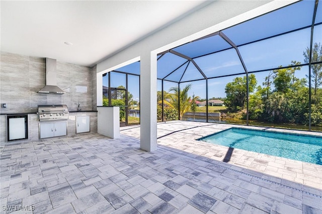 1316 SW 23rd St, Cape Coral, FL 33991 - outdoor pool featuring a patio area, glass enclosure, and a sink