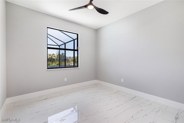 1316 SW 23rd St, Cape Coral, FL 33991 - unfurnished room featuring light marble finish flooring, baseboards, and a ceiling fan