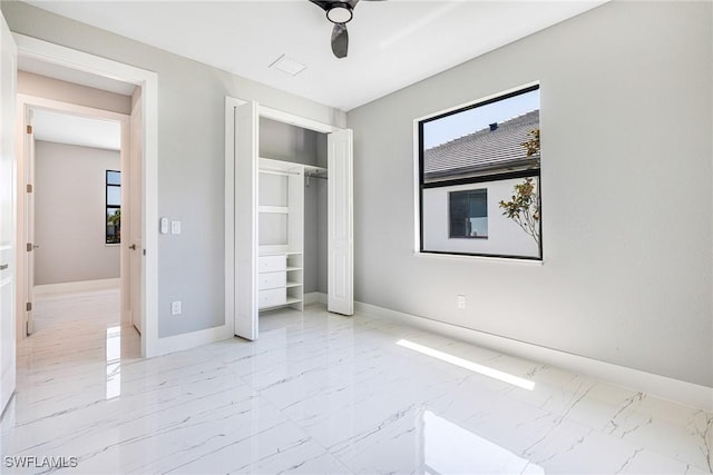 1316 SW 23rd St, Cape Coral, FL 33991 - unfurnished bedroom featuring marble finish flooring, baseboards, a closet, and a ceiling fan