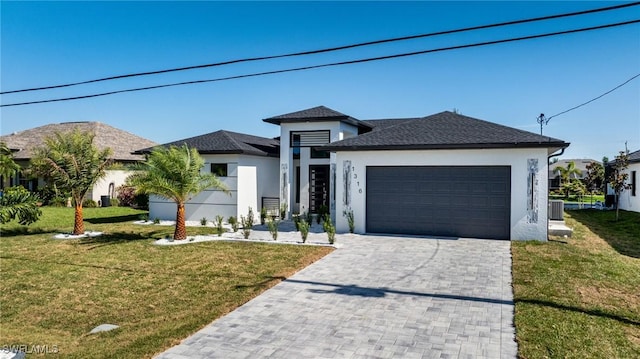 1316 SW 23rd St, Cape Coral, FL 33991 - view of front of house with stucco siding, a garage, a front yard, and decorative driveway