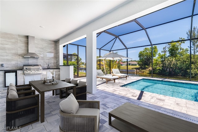 1316 SW 23rd St, Cape Coral, FL 33991 - view of patio featuring glass enclosure, an outdoor pool, outdoor dining area, an outdoor hangout area, and a sink