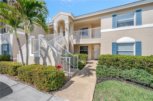 6448 Huntington Lakes Cir Unit 102, Naples, FL 34119 - view of building exterior featuring stairs