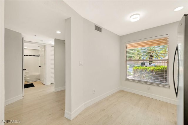 6448 Huntington Lakes Cir Unit 102, Naples, FL 34119 - spare room featuring light wood-style flooring and recessed lighting