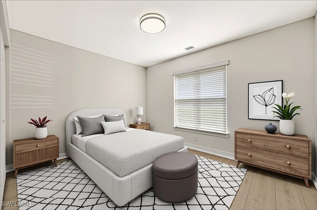 6448 Huntington Lakes Cir Unit 102, Naples, FL 34119 - bedroom featuring baseboards and light wood-type flooring
