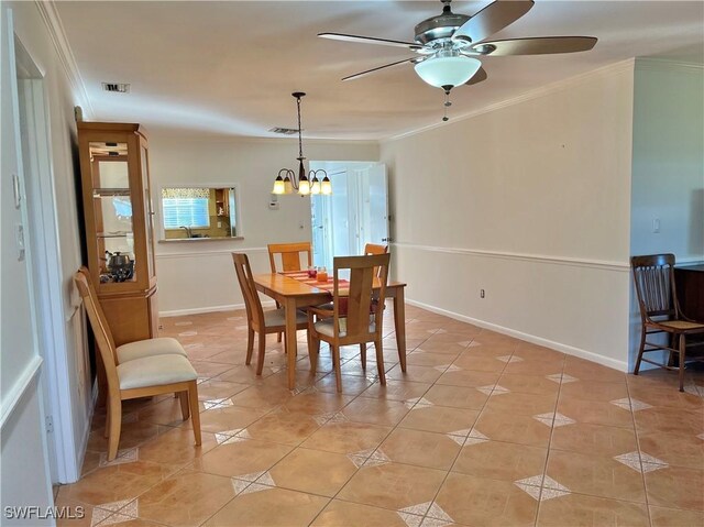 dining room featuring visible vents, crown molding, and light tile patterned floors