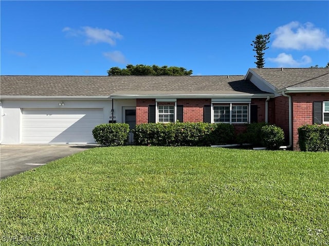 single story home with driveway, a shingled roof, an attached garage, a front lawn, and brick siding