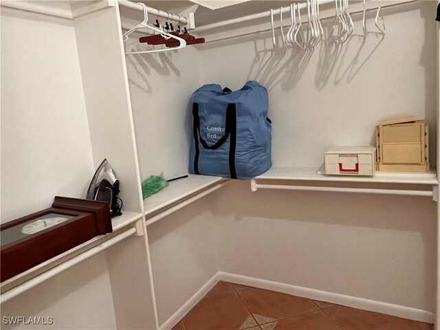 spacious closet featuring tile patterned flooring