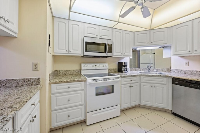 kitchen with white cabinetry, a ceiling fan, appliances with stainless steel finishes, and a sink