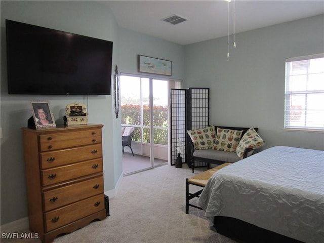 carpeted bedroom with baseboards and visible vents