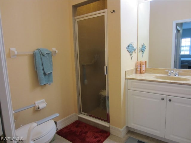 full bathroom with toilet, a stall shower, vanity, and baseboards