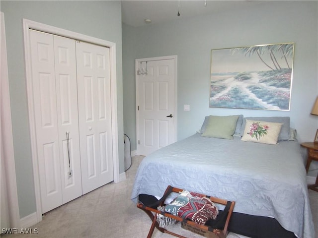 bedroom with a closet and baseboards