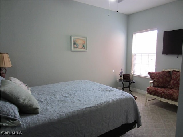 carpeted bedroom with baseboards