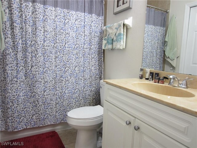 full bathroom with tile patterned flooring, a shower with shower curtain, vanity, and toilet