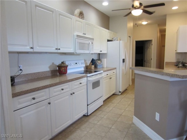 kitchen with light tile patterned floors, white appliances, white cabinetry, and recessed lighting