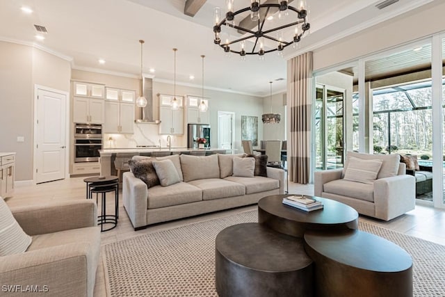 living room featuring visible vents, a chandelier, crown molding, and recessed lighting