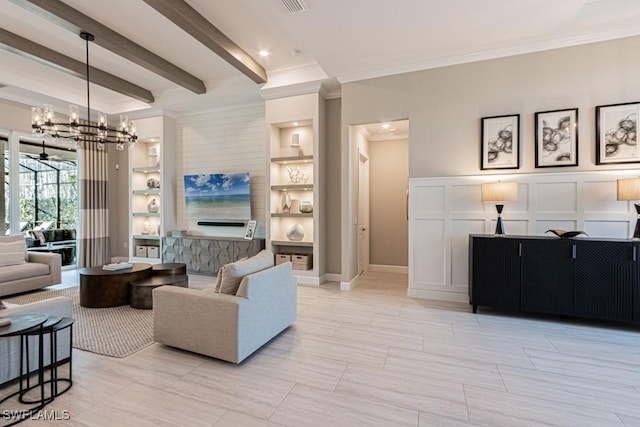 living room with a notable chandelier, a decorative wall, built in features, ornamental molding, and beamed ceiling