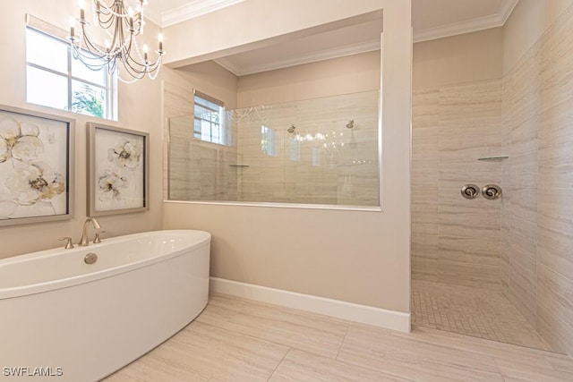 bathroom with baseboards, a soaking tub, walk in shower, and crown molding