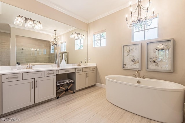 full bathroom with a chandelier, a tile shower, a sink, and ornamental molding