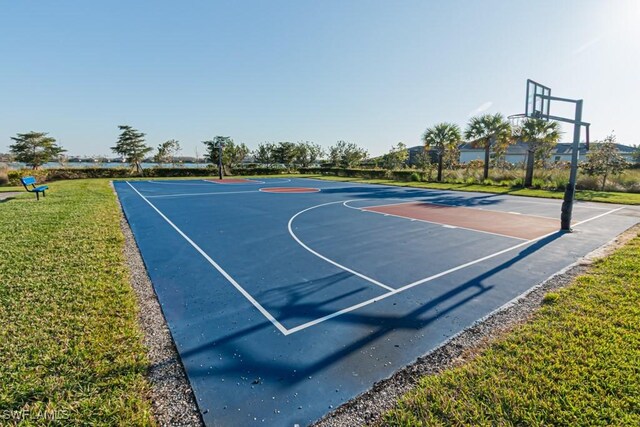 view of sport court with community basketball court and a lawn