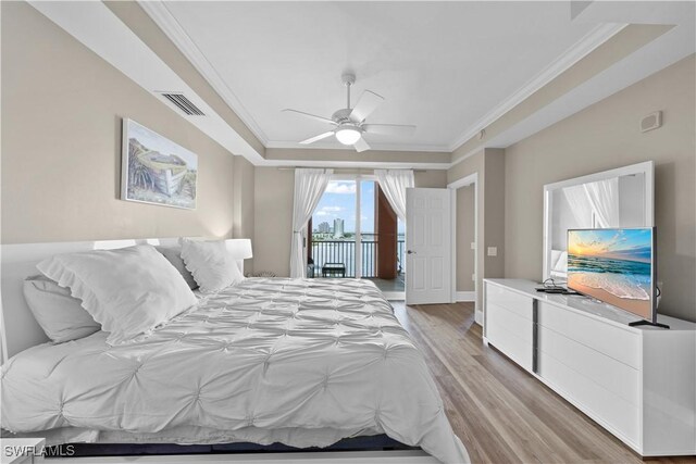 bedroom featuring visible vents, a ceiling fan, light wood-style flooring, access to exterior, and crown molding