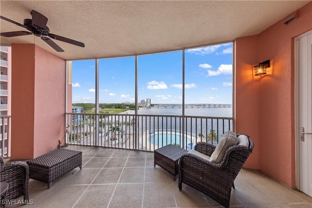 sunroom / solarium with a water view