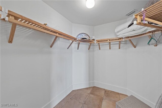 walk in closet featuring visible vents