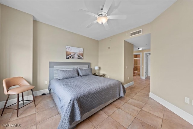 bedroom featuring a ceiling fan, light tile patterned flooring, visible vents, and baseboards