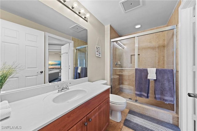 full bathroom with a stall shower, visible vents, toilet, tile patterned floors, and vanity