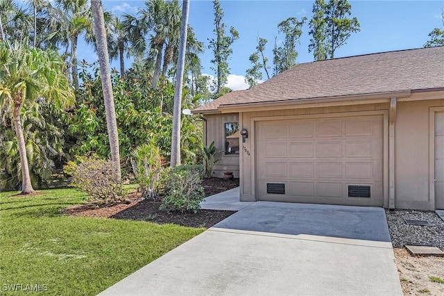 garage featuring driveway