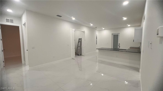 interior space featuring recessed lighting, marble finish floor, visible vents, and baseboards