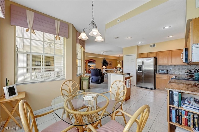 dining room with light tile patterned floors, recessed lighting, visible vents, and baseboards