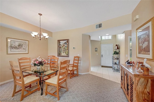 dining room with light tile patterned floors, light carpet, visible vents, baseboards, and an inviting chandelier