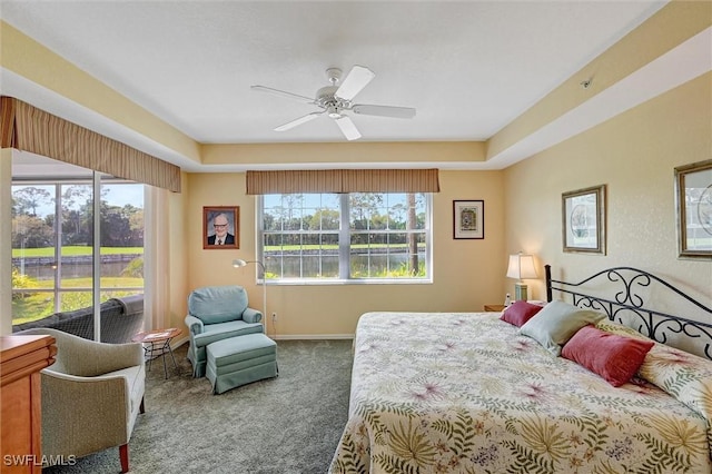 bedroom featuring ceiling fan, baseboards, and carpet flooring