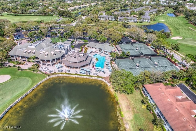 birds eye view of property featuring golf course view and a water view