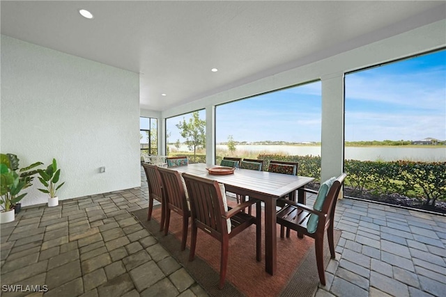 sunroom with a water view