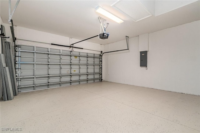 garage featuring electric panel and a garage door opener