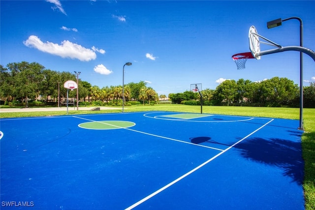 view of sport court with a yard and community basketball court