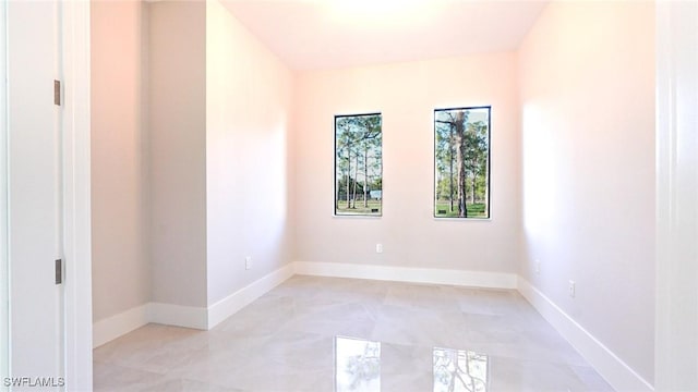 empty room with baseboards