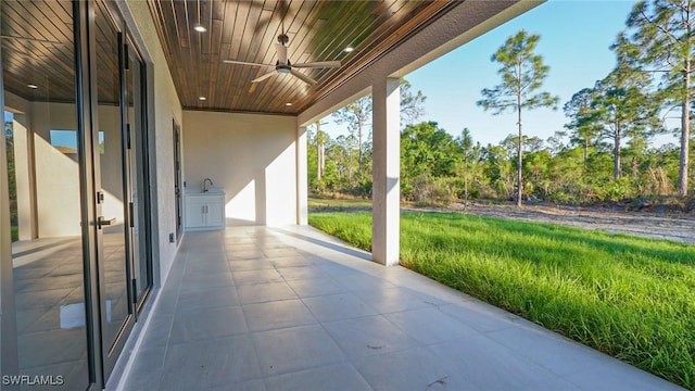 view of patio / terrace featuring ceiling fan and a sink