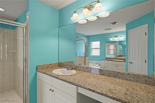 9325 La Bianco St, Estero, FL 33967 - full bathroom featuring a stall shower, visible vents, a bath, and vanity
