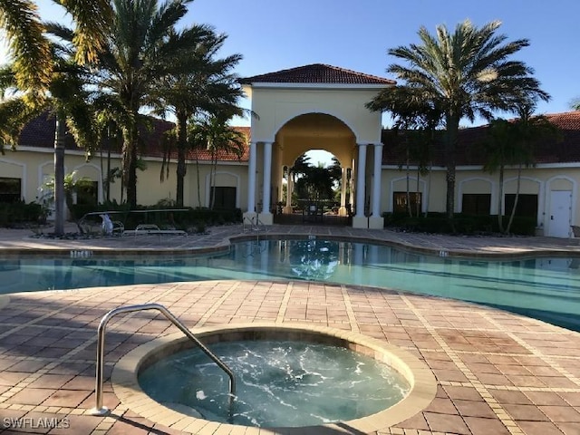 9325 La Bianco St, Estero, FL 33967 - community pool with a community hot tub and a patio
