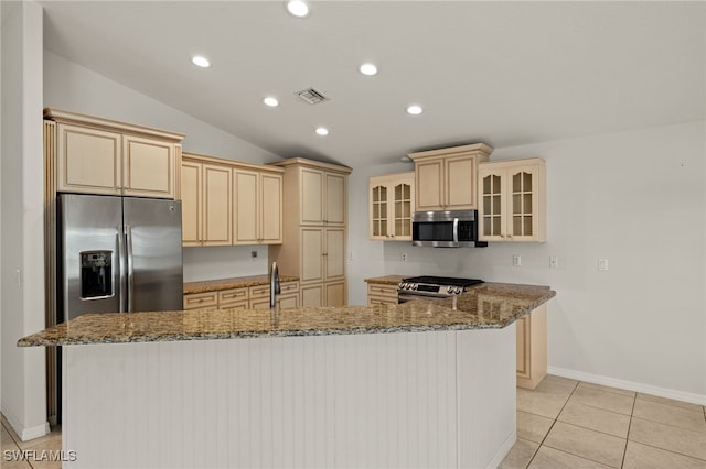 9325 La Bianco St, Estero, FL 33967 - kitchen featuring stone counters, a center island with sink, stainless steel appliances, visible vents, and glass insert cabinets