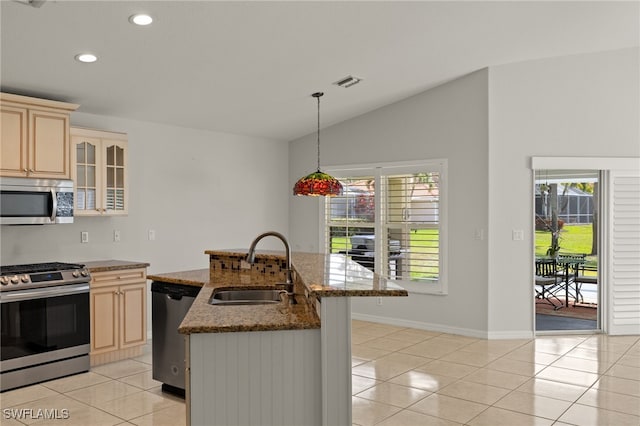 9325 La Bianco St, Estero, FL 33967 - kitchen featuring visible vents, appliances with stainless steel finishes, light tile patterned flooring, vaulted ceiling, and a sink