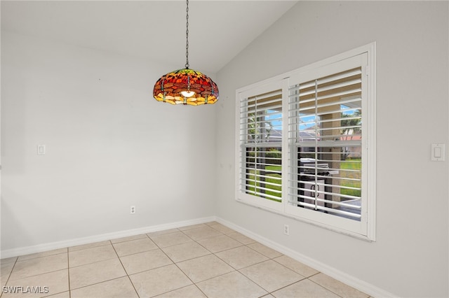 9325 La Bianco St, Estero, FL 33967 - empty room with lofted ceiling, light tile patterned floors, and baseboards