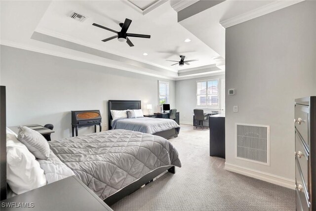 carpeted bedroom with baseboards, visible vents, a raised ceiling, and ornamental molding