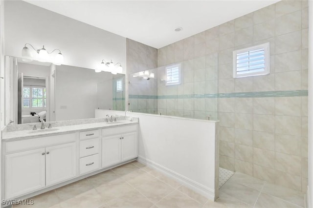 14821 Windward Ln, Naples, FL 34114 - full bath featuring double vanity, walk in shower, a sink, and tile patterned flooring