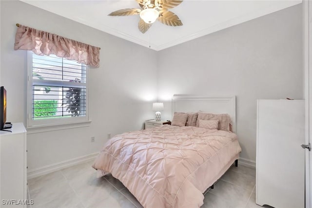 bedroom featuring crown molding, baseboards, and light tile patterned floors