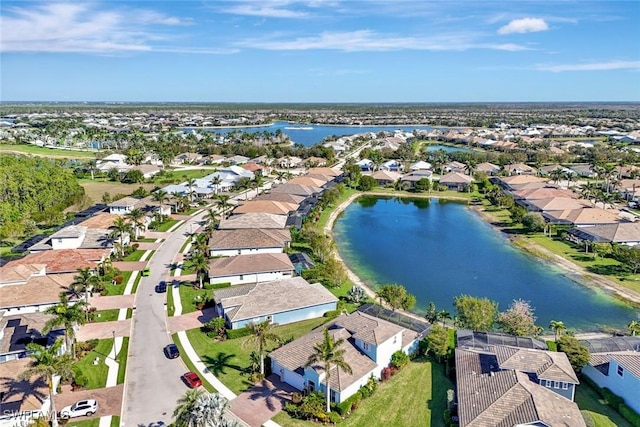 bird's eye view with a residential view and a water view